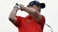 Els celebrates birthday with share of Champions lead