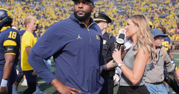 Michigan and coach Moore drop appeal of NCAA penalties from sign
