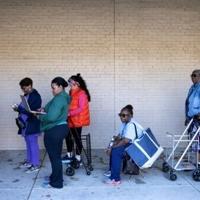 Frustrated federal employees line up for food as US shutdown wears on