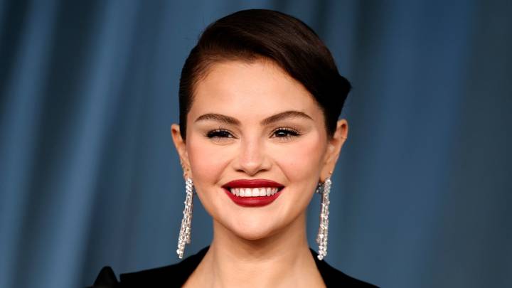 Selena Gomez jumps on the cherry red trend for AW25 in backless jumpsuit