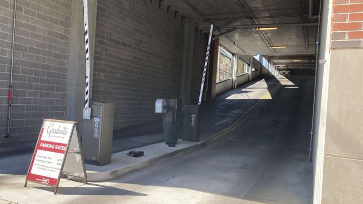 Woman dies after SUV crashes into wall exiting hotel parking garage