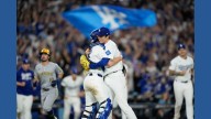Shohei Ohtani hits 3 homers, dominates on mound in Dodgers' clinching 5