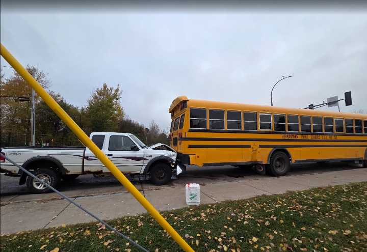 Truck collides with school bus in Hermantown