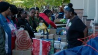 Federal workers form line down the block for food pantry as shutdown hits third