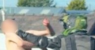 Naked road runner gets a punch from biker after near miss