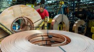 Copper pushes back toward $11,000 as test of record high beckons