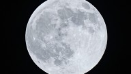 The Harvest moon rises over the Little San Bernardino Mountains