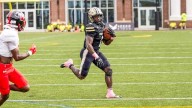 James' career day lifts Trojans to 35