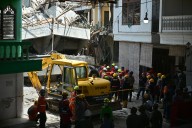Survivors pulled from collapsed school in Indonesia