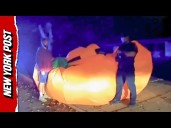 Police Wrestle Massive Inflatable Pumpkin Running Loose Through Ohio Neighborhood