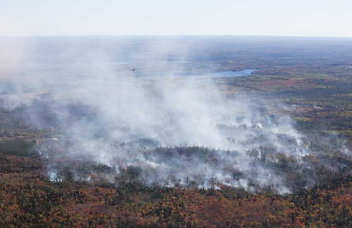 Nova Scotia wildfire burning out of control amid hot fall weather