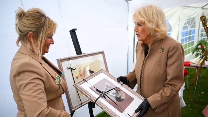 Delighted Queen Camilla has her beloved dogs