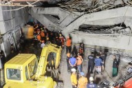 Indonesian crews pull 3 bodies from rubble of collapsed school with more than 50 boys still missing