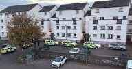 'Armed police' storm Edinburgh estate amid ongoing incident