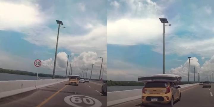 Sin cuerdas y contra el viento: transportaron un colchón en el techo de un taxi a toda velocidad por carretera de Cartagena