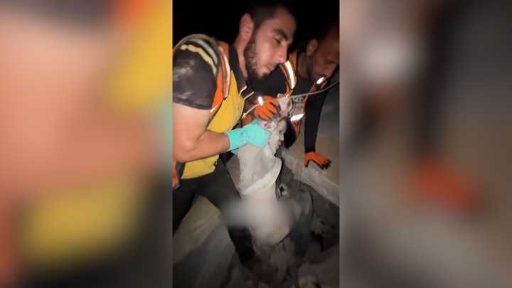 Boy pulled from the rubble of his home after Israeli airstrike in Gaza