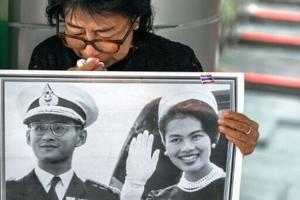 Black-clad Thai mourners weep for former Queen Sirikit