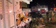 8 displaced after car strikes Manchester duplex, officials say