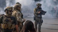 Trump deploys National Guard troops to Chicago as scores of protestors heatedly face off against federal immigration agents