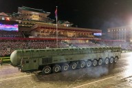 Trump notably absent from North Korean parade marking Kim Jong Un’s rule with new advanced missiles