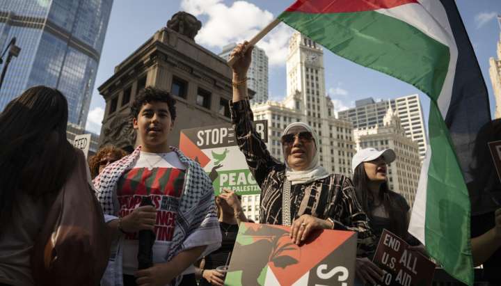Hundreds gather in the Loop to mark two years of the Israel