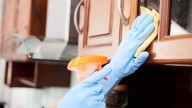 The Popular Household Cleaner To Avoid Using On Grimy Kitchen Cabinets And Why