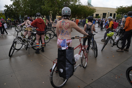 Naked bike riders demonstrate against federal troops in 'quintessentially Portland' protest