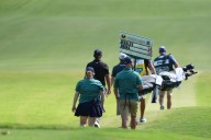 Vince Whaley has an audience with a set of teeth. He hits shot with alligator behind him