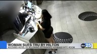 Woman sues Tru by Hilton, accuses estranged husband of getting room