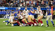 Short-handed 49ers stop Rams on downs in overtime, preserving a 26