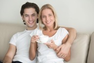 Dear Abby: My boyfriend's friends keep trying to set him up with someone younger