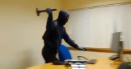 Moment masked Edinburgh man rampages through office armed with a hammer