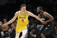 Reaves' buzzer-beater carries Lakers past Timberwolves