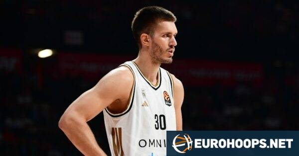 Filip Petrusev reacts to booing by Olympiacos fans