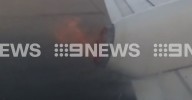 Adelaide airport: Rex Airlines Passengers look out the window to see plane wing on fire