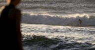 Warning after deaths of surfer and friend in wild winds