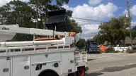 Dump truck strikes power lines in Longwood, portion of SR