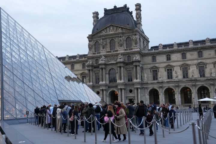 The Louvre reopens three days after thieves took French crown jewels in a daylight heist at the Paris museum