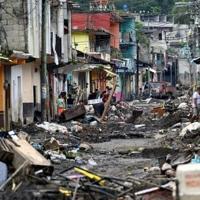 Flood-hit Mexican town digs out debris, fearing disease outbreaks