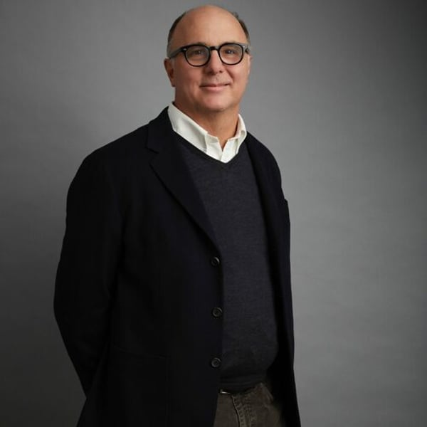 Prada CEO Andrea Guerra says Versace deal set to close in fortnight, no approach made by Armani