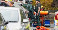 Four hurt, person shot by police near UK synagogue