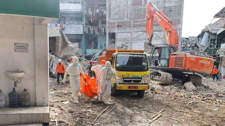 Indonesian rescuers search for missing students after school collapse kills 49