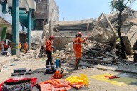 More bodies pulled from rubble of school in Indonesia