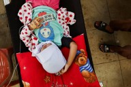 Indonesia investigates more free meal poisoning cases, after 700 students fall ill, official says