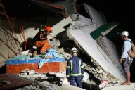 Rescuers desperately search for survivors of earthquake in the Philippines that killed at least 72