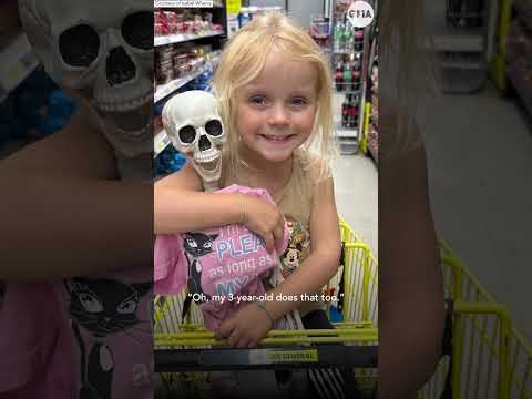 Toddler goes everywhere with her Halloween skeleton best friend