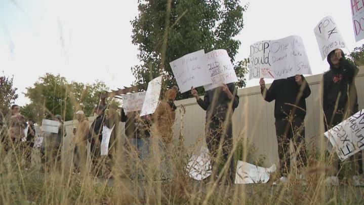 Post Falls High School students, parents protest suspension of football players over 'controversial' photo
