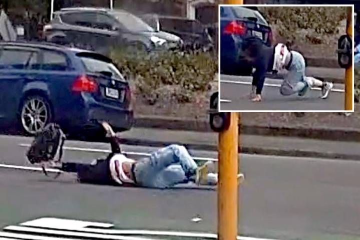 Massive winds blow pedestrian into oncoming traffic in terrifying scene