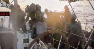 Israeli navy intercepts some flotilla boats but others are nearing the coast of Gaza, activists say