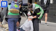Tensions erupt on Melbourne streets as opposing immigration rallies held across Australian capitals
